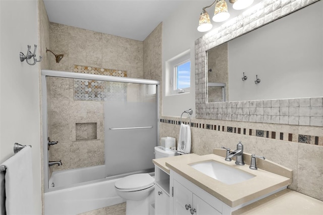 830 Egret Ln, Key Largo, FL 33037 - bathroom featuring vanity, bath / shower combo with glass door, and tile walls