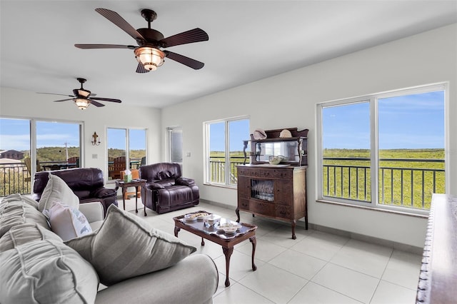 830 Egret Ln, Key Largo, FL 33037 - living area featuring healthy amount of natural light, a ceiling fan, and light tile patterned floors