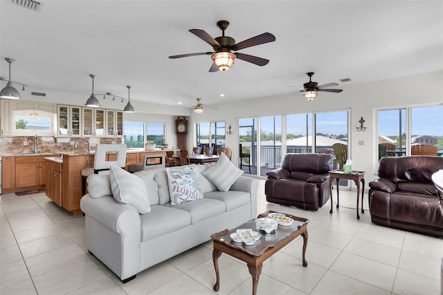 830 Egret Ln, Key Largo, FL 33037 - living room with light tile patterned flooring and ceiling fan