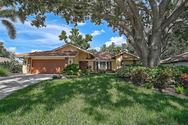 1674 Cottonwood Trl, Sarasota, FL 34232 - single story home featuring stucco siding, a garage, a front lawn, and driveway