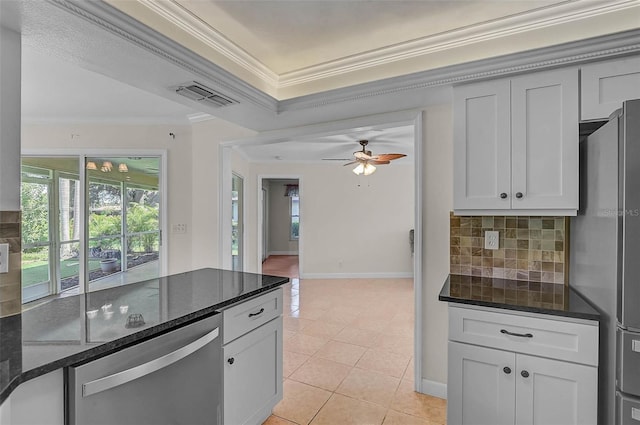 1674 Cottonwood Trl, Sarasota, FL 34232 - kitchen featuring appliances with stainless steel finishes, ornamental molding, backsplash, dark stone countertops, and light tile patterned floors
