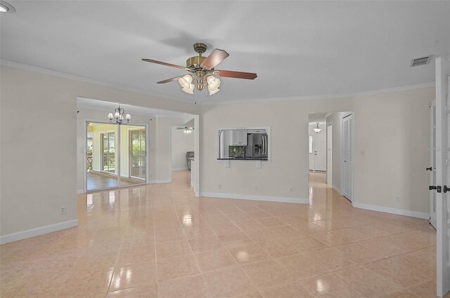 1674 Cottonwood Trl, Sarasota, FL 34232 - spare room with a ceiling fan, ornamental molding, a chandelier, and light tile patterned floors