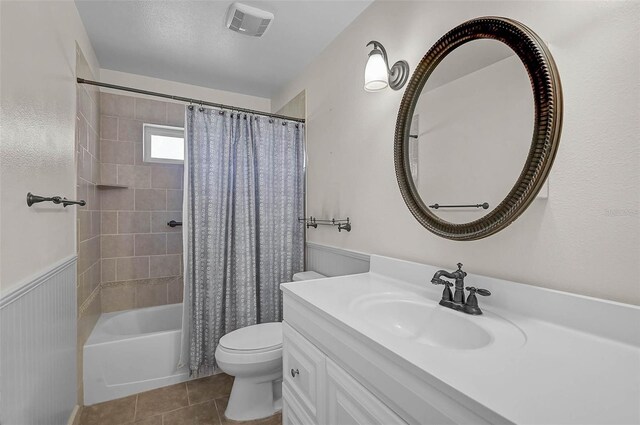 1674 Cottonwood Trl, Sarasota, FL 34232 - bathroom featuring vanity, shower / bath combo with shower curtain, and tile patterned flooring