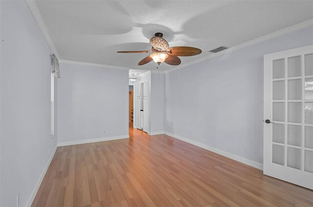 1674 Cottonwood Trl, Sarasota, FL 34232 - unfurnished room featuring ceiling fan, ornamental molding, a textured ceiling, and light wood finished floors