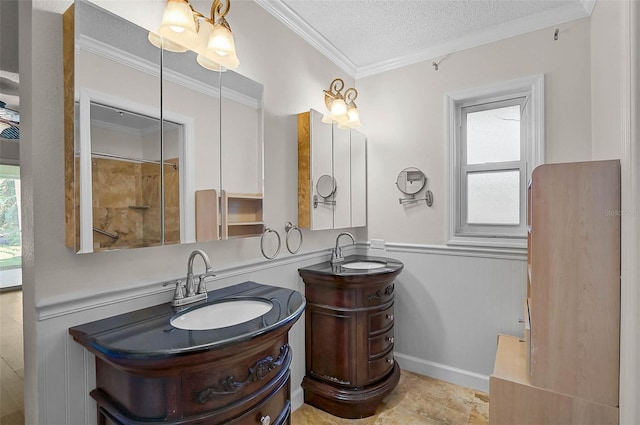 1674 Cottonwood Trl, Sarasota, FL 34232 - full bath with two vanities, a textured ceiling, ornamental molding, and wainscoting