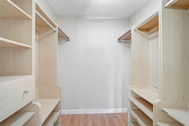 1674 Cottonwood Trl, Sarasota, FL 34232 - walk in closet featuring wood finished floors