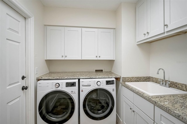 1674 Cottonwood Trl, Sarasota, FL 34232 - laundry room featuring cabinet space and independent washer and dryer