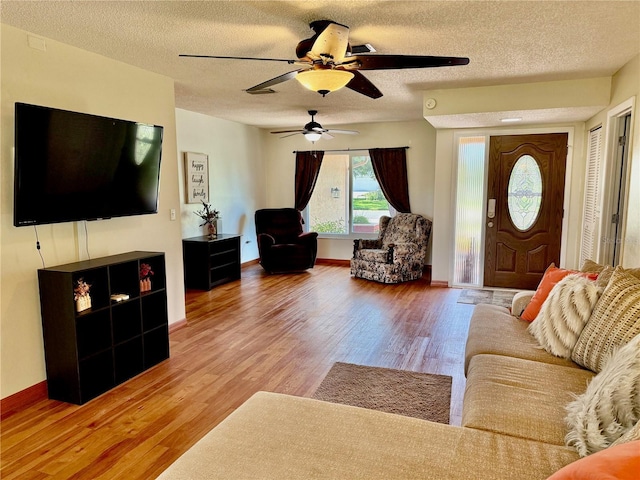 6806 18th Ave W, Bradenton, FL 34209 - living area with a ceiling fan, a textured ceiling, and wood finished floors