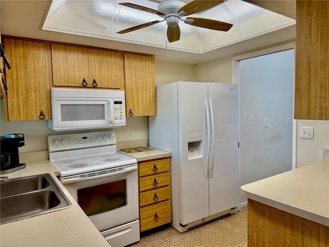 6806 18th Ave W, Bradenton, FL 34209 - kitchen featuring white appliances, a ceiling fan, brown cabinetry, and light countertops