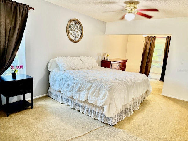 6806 18th Ave W, Bradenton, FL 34209 - bedroom with light colored carpet, a textured ceiling, and ceiling fan