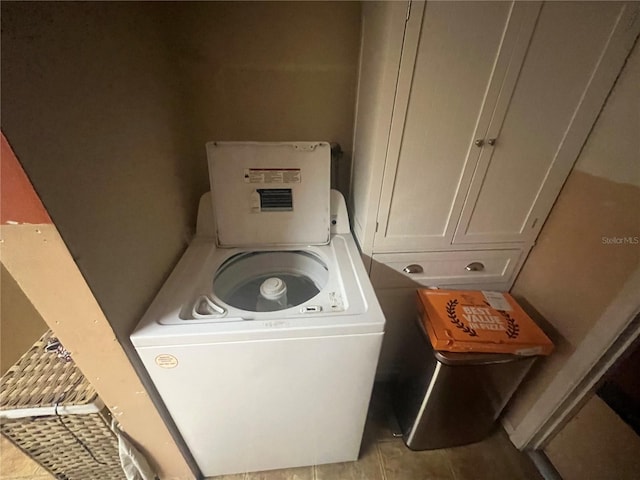 11234 Areca Dr, Port Richey, FL 34668 - washroom with washer / clothes dryer and light tile patterned floors