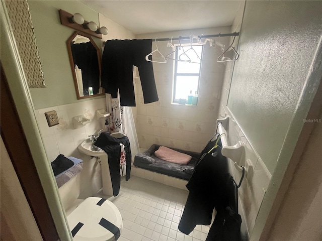 11234 Areca Dr, Port Richey, FL 34668 - bathroom featuring a stall shower, tile patterned floors, and tile walls