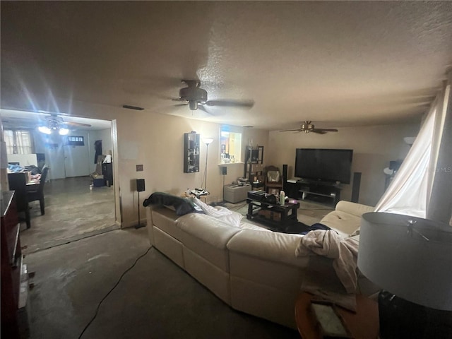 11234 Areca Dr, Port Richey, FL 34668 - living area featuring a ceiling fan, concrete flooring, and a textured ceiling