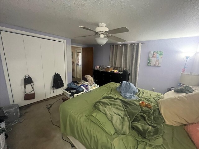 11234 Areca Dr, Port Richey, FL 34668 - bedroom with a textured ceiling, a closet, carpet floors, and a ceiling fan