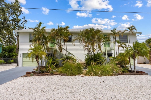 4508 101st St W Unit A, Bradenton, FL 34210 - view of front facade featuring stairs, driveway, and a garage