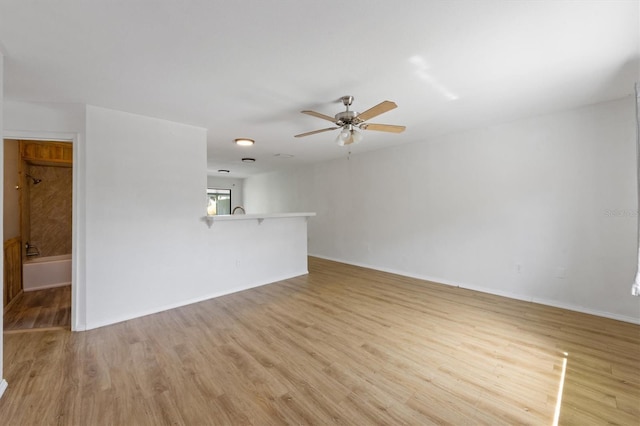 4508 101st St W Unit A, Bradenton, FL 34210 - unfurnished living room featuring light wood-style flooring and a ceiling fan