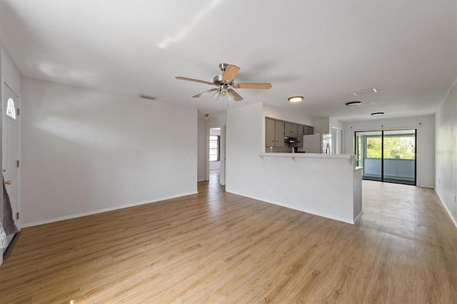 4508 101st St W Unit A, Bradenton, FL 34210 - unfurnished living room with a ceiling fan and light wood-type flooring