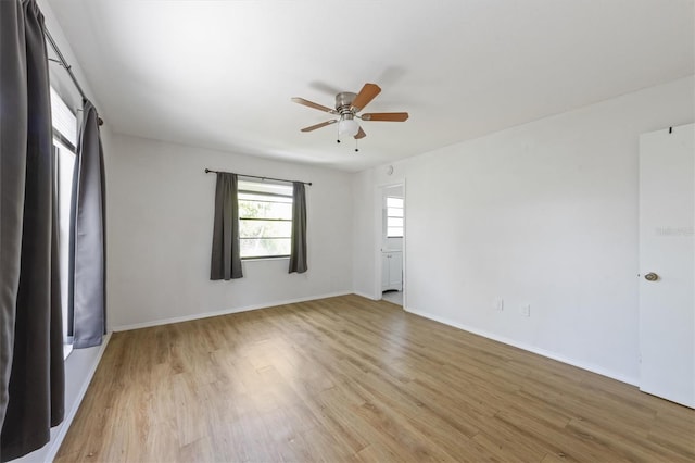 4508 101st St W Unit A, Bradenton, FL 34210 - empty room with ceiling fan and light wood-type flooring