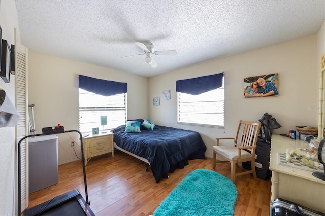 4508 101st St W Unit A, Bradenton, FL 34210 - bedroom featuring wood finished floors, a textured ceiling, and ceiling fan