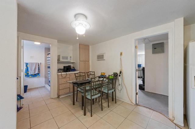 4508 101st St W Unit A, Bradenton, FL 34210 - dining area featuring light tile patterned floors, water heater, electric panel, and ceiling fan