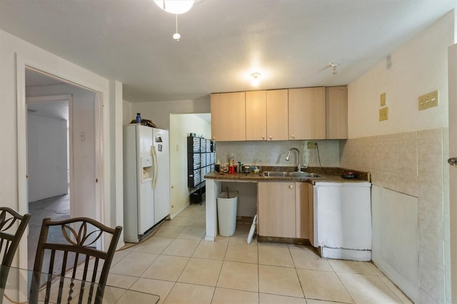 4508 101st St W Unit A, Bradenton, FL 34210 - kitchen with white fridge with ice dispenser, light brown cabinets, light tile patterned floors, and dark countertops