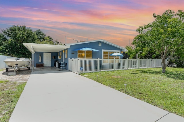 4481 Lagg Ave, Fort Myers, FL 33901 - view of front facade featuring concrete driveway and an attached carport