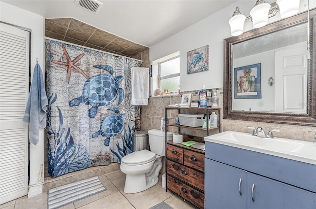 4481 Lagg Ave, Fort Myers, FL 33901 - full bath with tile walls, vanity, tile patterned flooring, and curtained shower