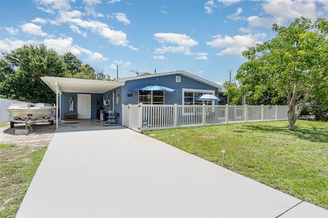 4481 Lagg Ave, Fort Myers, FL 33901 - manufactured / mobile home with concrete driveway and an attached carport
