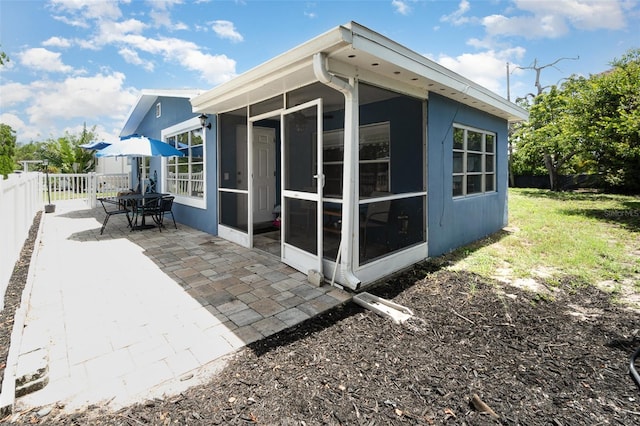 4481 Lagg Ave, Fort Myers, FL 33901 - rear view of property with a sunroom and a patio area