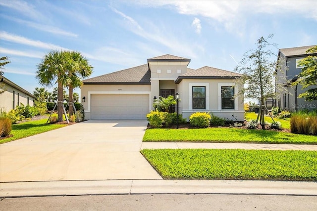 9292 Tequila Sunrise Dr, Sarasota, FL 34241 - view of front of property featuring stucco siding, a garage, and driveway