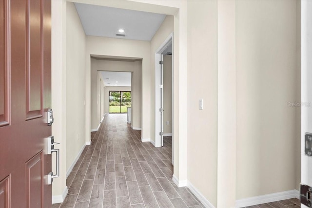 9292 Tequila Sunrise Dr, Sarasota, FL 34241 - corridor with wood finished floors and recessed lighting