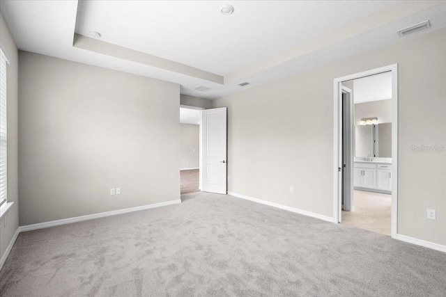 9292 Tequila Sunrise Dr, Sarasota, FL 34241 - unfurnished bedroom with light colored carpet and connected bathroom