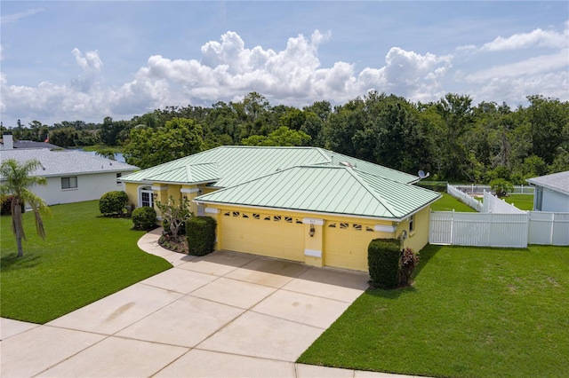 6114 68th Dr E, Palmetto, FL 34221 - ranch-style house featuring a standing seam roof, stucco siding, concrete driveway, and a metal roof