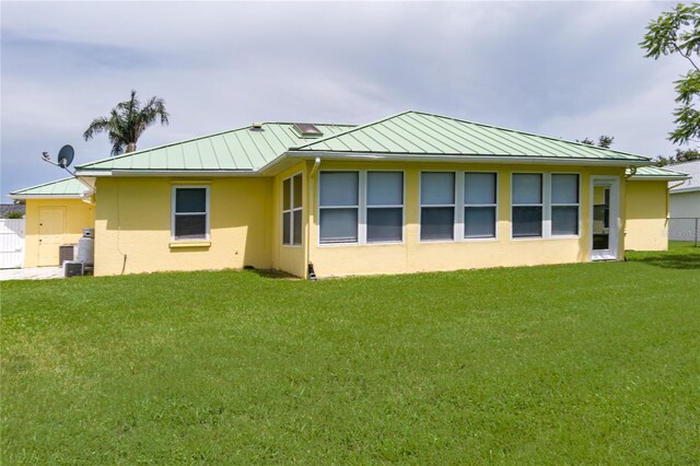 6114 68th Dr E, Palmetto, FL 34221 - back of house with a standing seam roof, a metal roof, and stucco siding