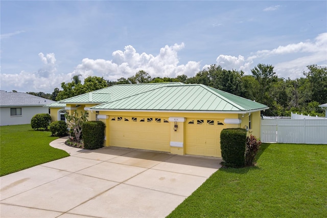 6114 68th Dr E, Palmetto, FL 34221 - single story home with a standing seam roof, concrete driveway, stucco siding, and an attached garage