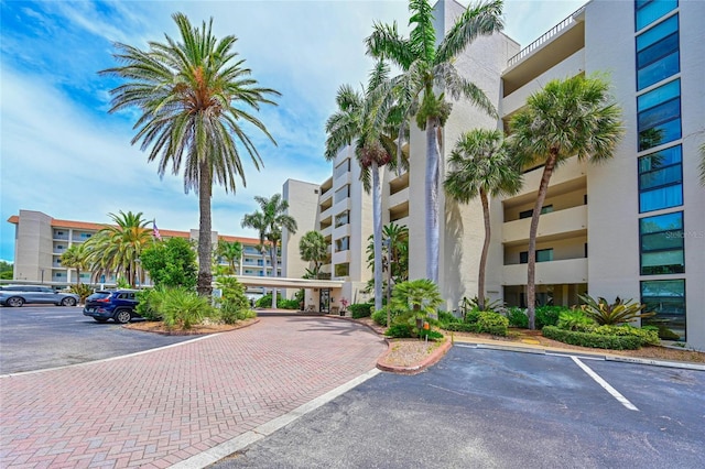 1510 1st Ave W Unit 102, Bradenton, FL 34205 - view of apartment building / complex featuring uncovered parking