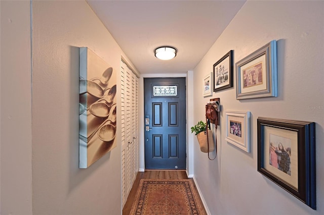 1510 1st Ave W Unit 102, Bradenton, FL 34205 - doorway to outside featuring wood finished floors and baseboards