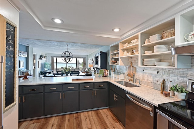 1510 1st Ave W Unit 102, Bradenton, FL 34205 - kitchen with appliances with stainless steel finishes, light countertops, light wood-style flooring, and recessed lighting