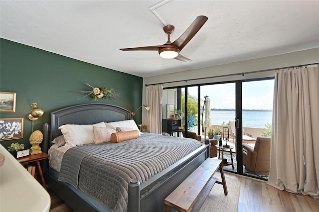 1510 1st Ave W Unit 102, Bradenton, FL 34205 - bedroom with a water view, light wood-style floors, access to outside, and a ceiling fan