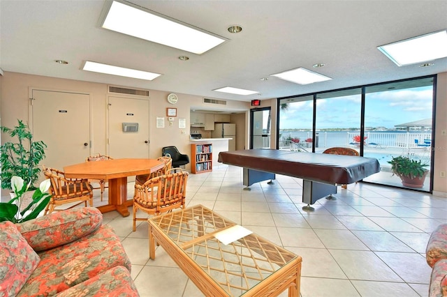 1510 1st Ave W Unit 102, Bradenton, FL 34205 - playroom featuring a skylight, light tile patterned flooring, and recessed lighting