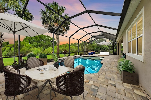 3379 Chestertown Loop, Bradenton, FL 34211 - outdoor pool with a patio, a jacuzzi, glass enclosure, and outdoor dining area