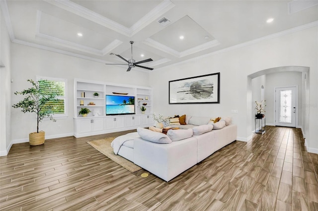 3379 Chestertown Loop, Bradenton, FL 34211 - living room featuring arched walkways, healthy amount of natural light, light wood-style flooring, beam ceiling, and coffered ceiling