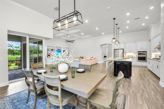 3379 Chestertown Loop, Bradenton, FL 34211 - dining area featuring crown molding, coffered ceiling, recessed lighting, ceiling fan, and a high ceiling