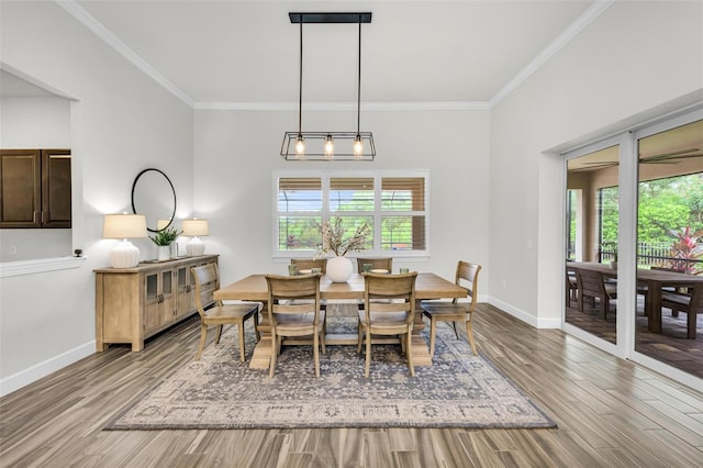 3379 Chestertown Loop, Bradenton, FL 34211 - dining room featuring healthy amount of natural light, wood finished floors, and ornamental molding