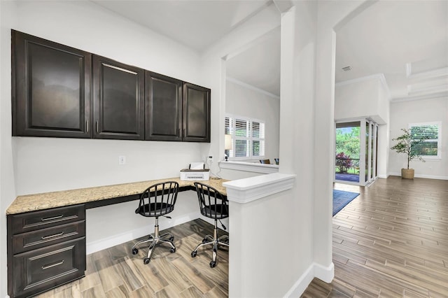3379 Chestertown Loop, Bradenton, FL 34211 - home office featuring built in desk, light wood finished floors, and crown molding