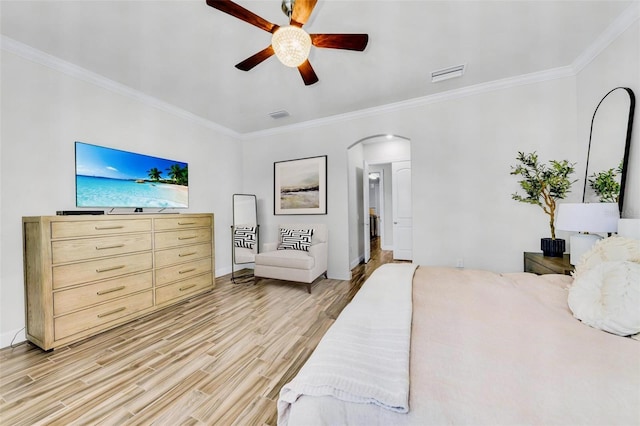 3379 Chestertown Loop, Bradenton, FL 34211 - bedroom featuring arched walkways, light wood-style flooring, crown molding, and a ceiling fan