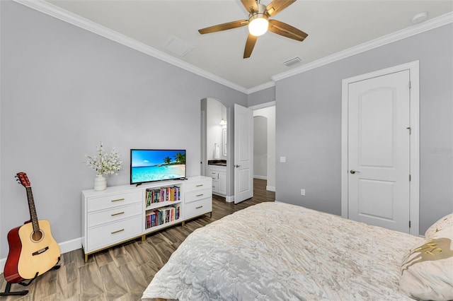 3379 Chestertown Loop, Bradenton, FL 34211 - bedroom with dark wood-style flooring, crown molding, arched walkways, ceiling fan, and ensuite bath