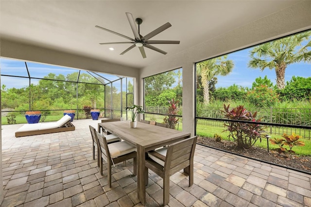 3379 Chestertown Loop, Bradenton, FL 34211 - sunroom / solarium with ceiling fan and outdoor dining space