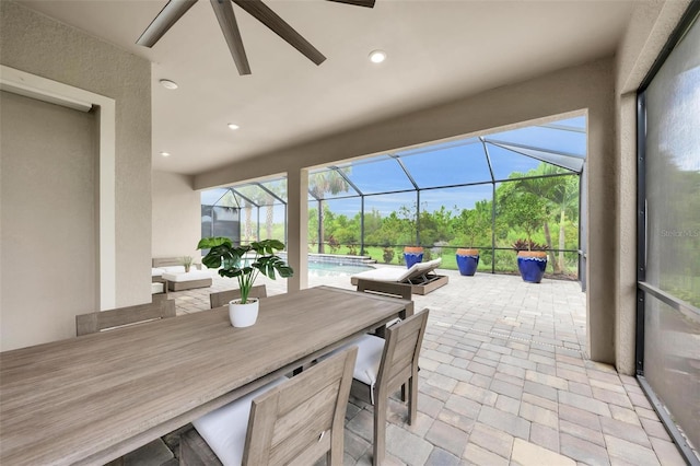 3379 Chestertown Loop, Bradenton, FL 34211 - view of patio / terrace featuring an outdoor pool, ceiling fan, glass enclosure, and outdoor dining space
