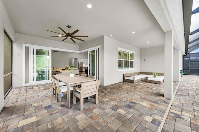 3379 Chestertown Loop, Bradenton, FL 34211 - view of patio / terrace with a ceiling fan, outdoor dining space, an outdoor hangout area, and a lanai